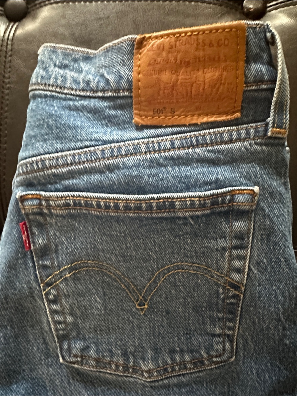 Levi's High-Rise Women's Denim Jeans in Medium Blue with Tan Patch